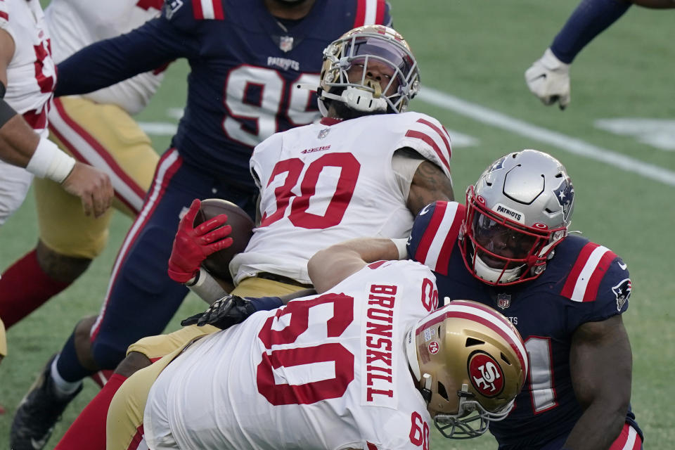 San Francisco 49ers running back Jeff Wilson Jr. (30) spins to gains yardage behind the block of tackle Daniel Brunskill (60) in the first half of an NFL football game against the New England Patriots, Sunday, Oct. 25, 2020, in Foxborough, Mass. (AP Photo/Steven Senne)