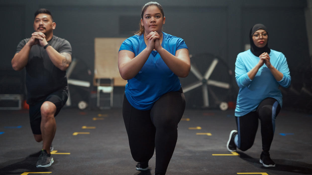  Three people performing lunges 