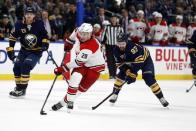 Nov 18, 2017; Buffalo, NY, USA; Carolina Hurricanes right wing Sebastian Aho (20) skates up ice while being defended by Buffalo Sabres defenseman Victor Antipin (93) during the third period at KeyBank Center. Mandatory Credit: Timothy T. Ludwig-USA TODAY Sports