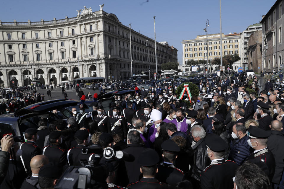 People attend the funerals of Italian ambassador to the Democratic Republic of Congo Luca Attanasio and Italian Carabinieri police officer Vittorio Iacovacci, in Rome, Thursday, Feb. 25, 2021. Italy paid tribute Thursday to its ambassador to Congo and his bodyguard who were killed in an attack on a U.N. convoy, honoring them with a state funeral and prayers for peace in Congo and all nations "torn by war and violence." (AP Photo/Andrew Medichini)