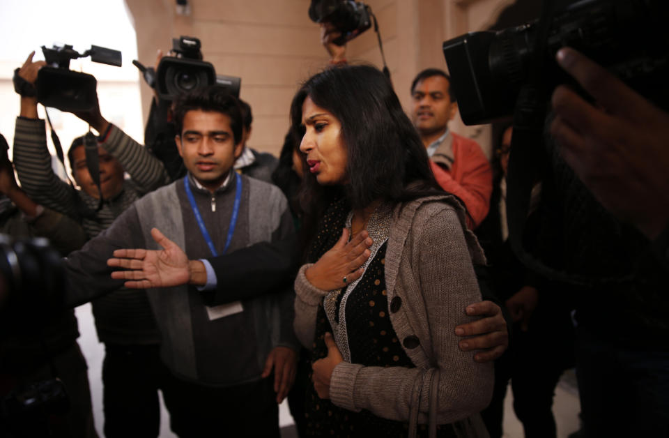 Devyani Khobragade, who served as India’s deputy consul general in New York, reacts as she is questioned by journalists in New Delhi, India, Saturday, Jan. 11, 2014. Khobragade, 39, is accused of exploiting her Indian-born housekeeper and nanny, allegedly having her work more than 100 hours a week for low pay and lying about it on a visa form. Khobragade has maintained her innocence, and Indian officials have described her treatment as barbaric. (AP Photo/Saurabh Das)