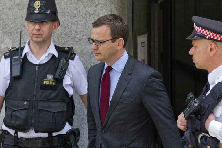 Former top aide to British Prime Minister David Cameron and former News of the World editor Andy Coulson leaves the Old Bailey in central London on June 25, 2014