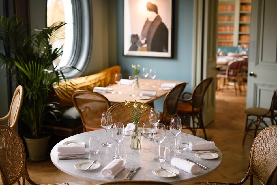 The dining room is a wonderfully serene space, complete with parlour palms and wicker chairs