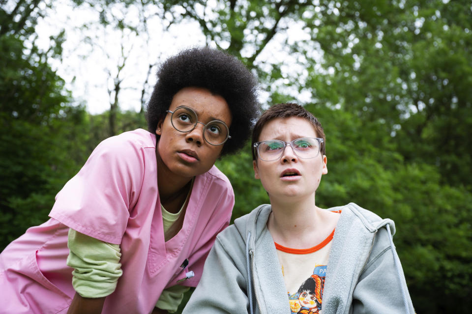 This image released by A24 shows Leah Harvey, left, and Lola Petticrew in a scene from "Tuesday." (Kevin Baker/A24 via AP)