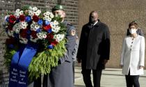 Annegret Kramp-Karrenbauer, Federal Minister of Defence, and U.S. Secretary of Defence Lloyd Austin lay down a wreath at the Federal Ministry of Defence in Berlin, Germany, Tuesday, April 13, 2021. This is the first visit to Germany by a minister of the new US administration. Austin will then travel on to Stuttgart, where he will talk to soldiers at the US command centres for troops in Africa and Europe. (Kay Nietfeld/dpa via AP)