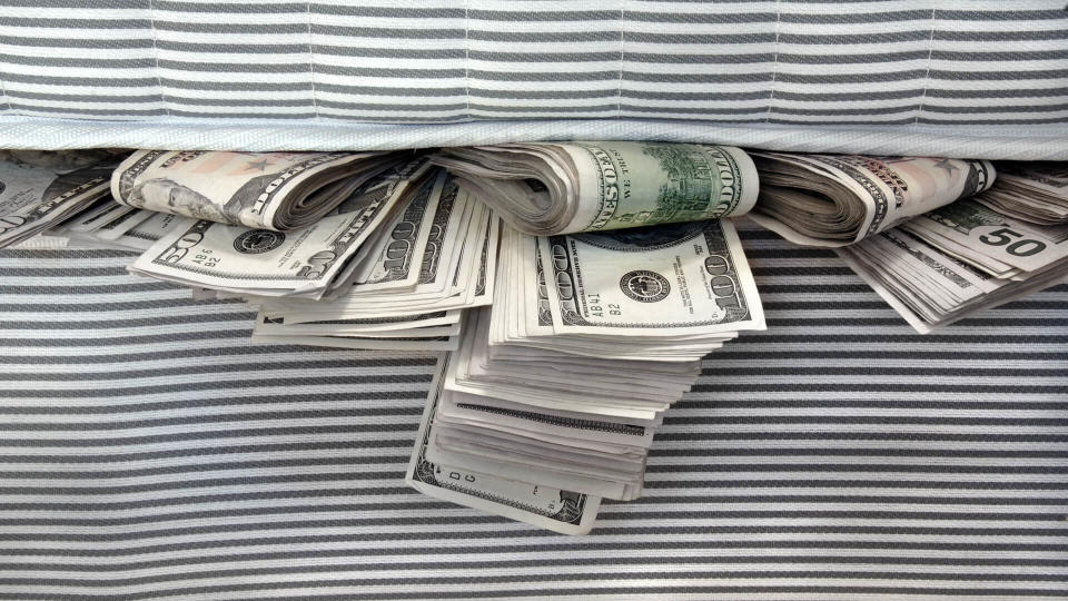 Cash stashed for safe keeping in between mattresses.