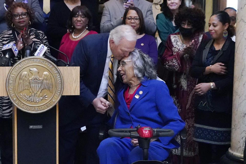 Former Mississippi State Rep. Alyce Clarke, D-Jackson, right, accepts congratulations from House of Representatives Speaker Pro Tempore Manly Barton, R-Moss Point, during the ceremony where Clarke's official portrait was unveiled at the Mississippi State Capitol, Tuesday, Feb. 13, 2024, in Jackson. Clarke, a long-time legislator, is the first woman and the first African American to have a portrait hanging in the state Capitol. (AP Photo/Rogelio V. Solis)