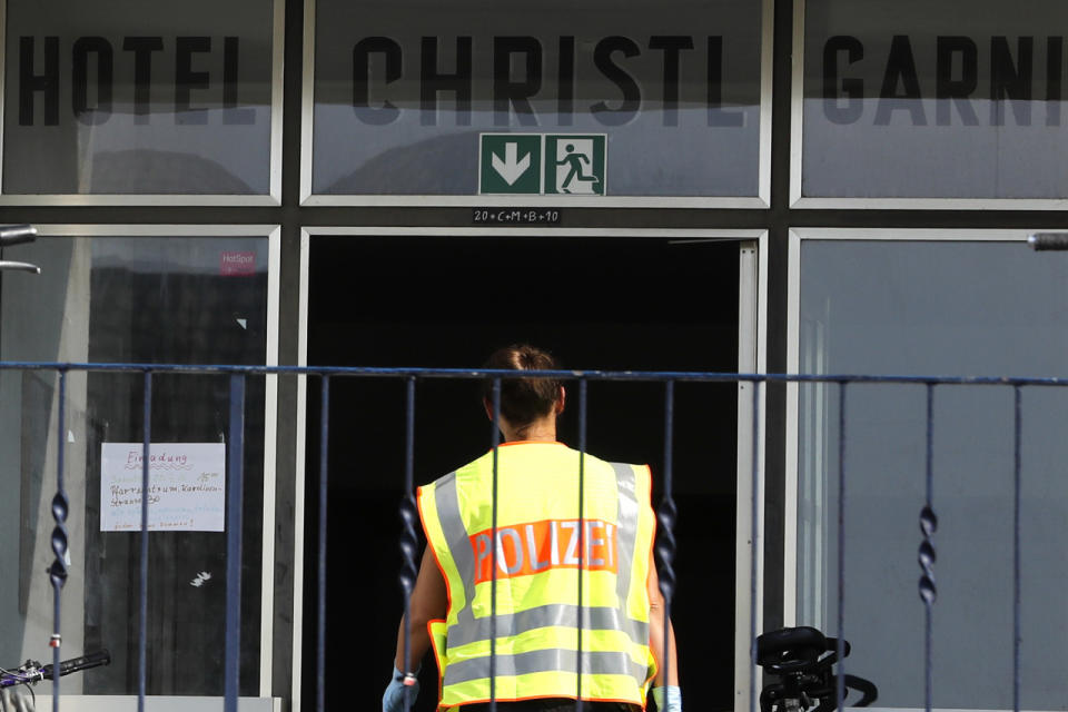 <p>A police officer enters a former hotel where a Syrian man lived before the explosion in Ansbach, Germany, Monday, July 25, 2016. (AP Photo/Matthias Schrader)</p>