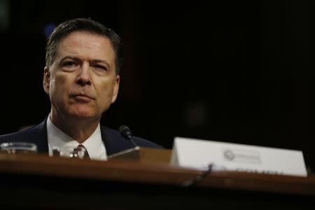 FILE PHOTO: Former FBI Director James Comey testifies before a Senate Intelligence Committee hearing on Russia's alleged interference in the 2016 U.S. presidential election on Capitol Hill in Washington, U.S., June 8, 2017. REUTERS/Jonathan Ernst/File Photo