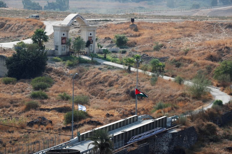 The national flags of Israel and Jordan are seen in an area known as Naharayim in Hebrew and Baquora in Arabic, in the border area between Israel and Jordan, as seen from the Israeli side