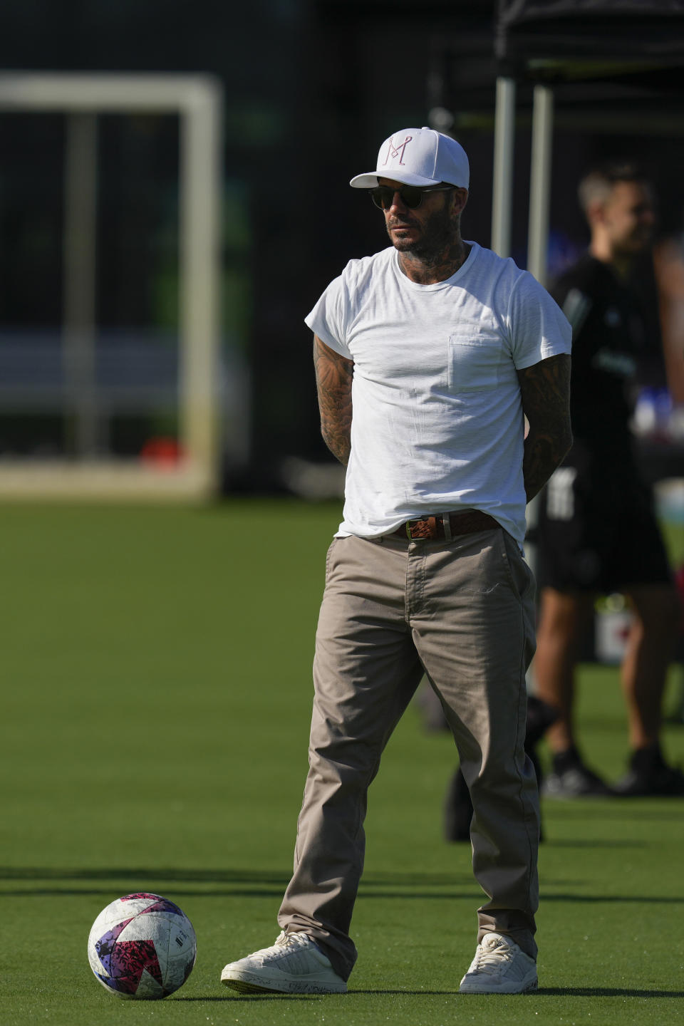 Team co-owner David Beckham walks on the sideline during a training session for the Inter Miami MLS soccer team Tuesday, July 18, 2023, in Fort Lauderdale, Fla. (AP Photo/Rebecca Blackwell)