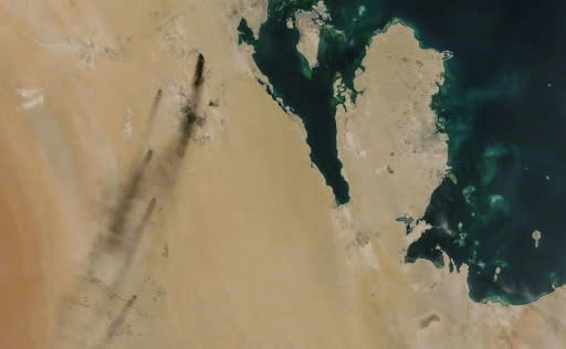 A satellite image provided by NASA Worldview shows fires following drone strikes on two major oil installation owned by the state giant Aramco, in eastern Saudi Arabia