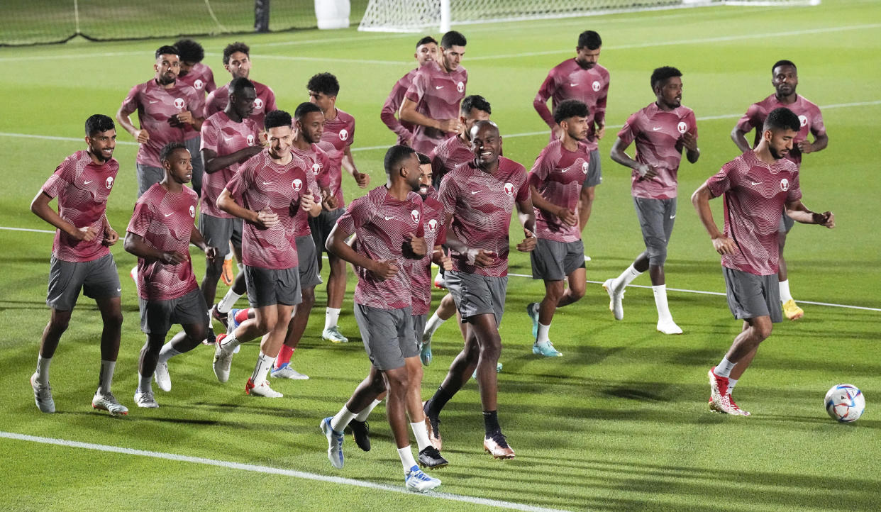 Players exercise during Qatar's official training ahead of the FIFA World Cup (Martin Meissner / AP)