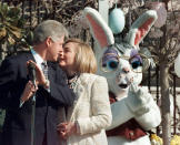 <p>As the Easter Bunny applauds at right, President Clinton huddles with first lady Hillary Rodham Clinton at the White House, Monday, April 8, 1996, during the annual White House Easter Egg Roll and Hunt. (Photo: Dennis Cook/AP) </p>