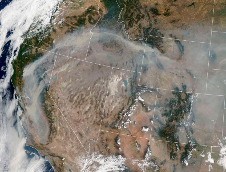 A satellite image shows smoke plumes from the California wildfires migrating across the American west.