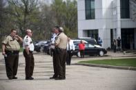 Police officers gather outside of Paisley Park, U.S. music superstar Prince's estate in Chanhassen, Minnesota April 21, 2016. Prince, the innovative U.S. music superstar whose songwriting and eccentric stage presence electrified fans around the world with hits including "Purple Rain" and "When Doves Cry," died on April 21, 2016 in Minnesota. He was 57. REUTERS/Craig Lassig