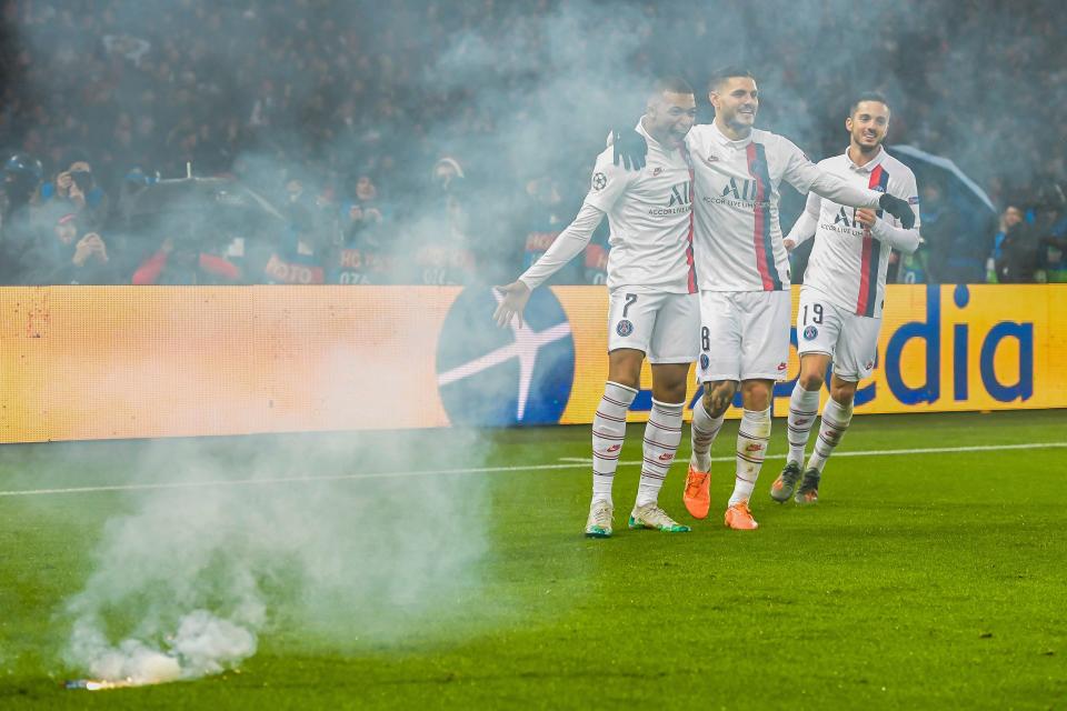 Kylian Mbappé (7) celebrated his goal in PSG's victory with teammates ... and fireworks. (Photo by ANP Sport via Getty Images)