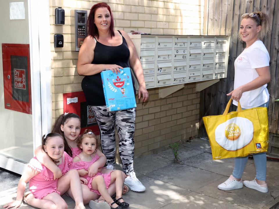 High Barnet family given food parcel by volunteer Katie-Louise Barber (right)Nigel Howard