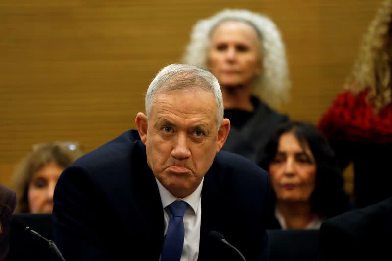 FILE PHOTO: Benny Gantz, leader of Blue and White party, reacts during a committee meeting at the Knesset, Israel's parliament, in Jerusalem
