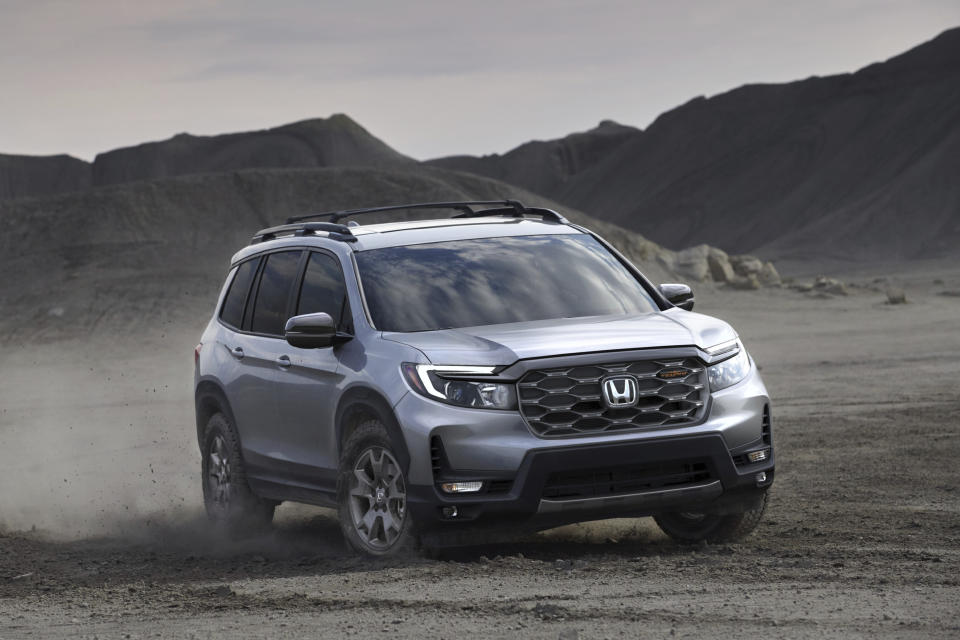This photo provided by Honda shows the 2024 Passport. The new TrailSport version pictured here has all-terrain tires and a specially tuned suspension. (Courtesy of American Honda Motor Co. via AP)