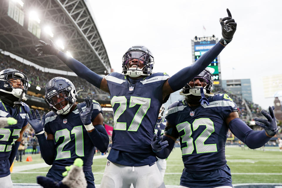 Devon Witherspoon #21 of the Seattle Seahawks, Riq Woolen #27 of the Seattle Seahawks, and Jerrick Reed II #32. (Photo by Steph Chambers/Getty Images)