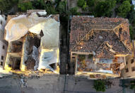 Heritage houses that were destroyed by Aug. 4 explosion that hit the seaport of Beirut, Lebanon, Monday Aug. 24, 2020. In the streets of Beirut historic neighborhoods, workers are erecting scaffolding to support buildings that have stood for more than a century - now at risk of collapse after the massive Aug. 4 explosion that tore through the capital. (AP Photo/Hussein Malla)