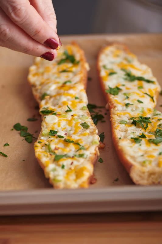<p>Katie Workman</p><p>Buttery, cheesy, garlicky, this is the oh-my-god cheesy garlic bread of your dreams.</p><p><strong>Get the recipe:<a href="https://themom100.com/recipe/cheesy-garlic-bread/" rel="nofollow noopener" target="_blank" data-ylk="slk:Cheesy Garlic Bread;elm:context_link;itc:0;sec:content-canvas" class="link "> Cheesy Garlic Bread</a></strong></p>