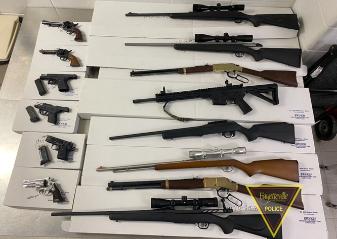 The Fayetteville Police Department released a photo of 14 firearms they say were seized from a home in the 100 block of Homeplace Court on Sept. 12.