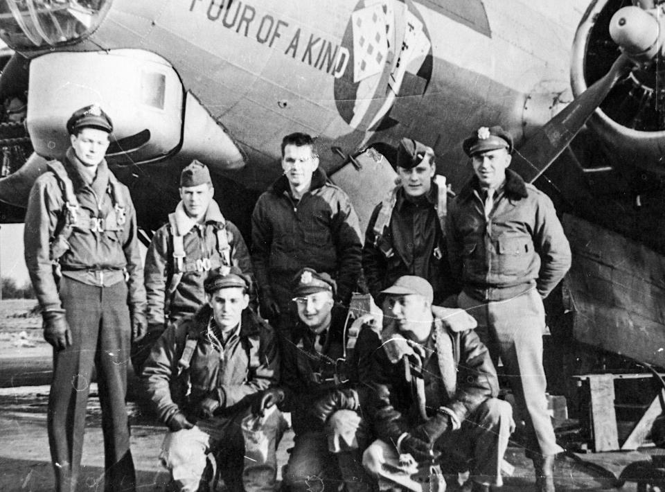 A photograph shows Vincent "Bill" J. Purple's B-17 crew in late 1944. Purple is kneeling on the left.