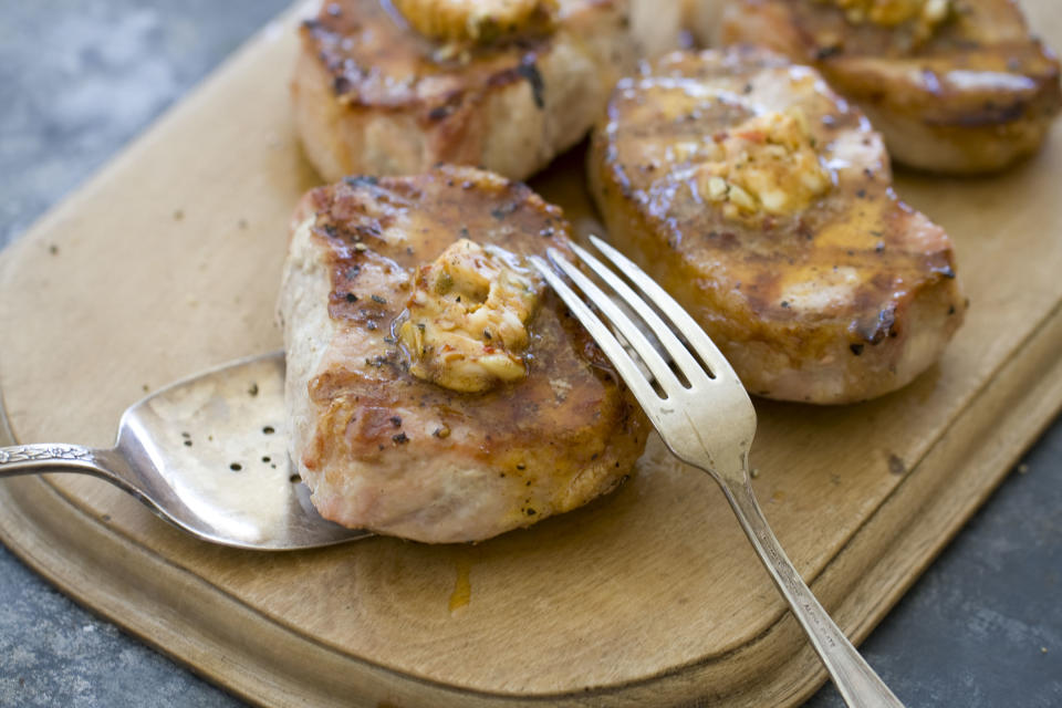 This Sept. 30, 2013 photo shows pork chops with chipotle pumpkin seed butter in Concord, N.H. (AP Photo/Matthew Mead)