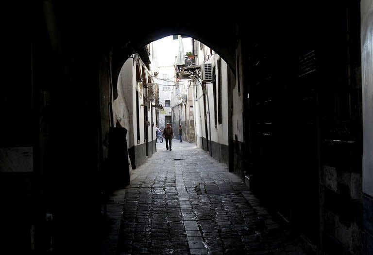 A Syrian walks along the cobbled street in Damascus, on September 21, 2013. The world's chemical weapons watchdog is pouring over an inventory of Syria's arsenal on the weekend ahead of an expected UN vote on how to secure and neutralise the lethal arms