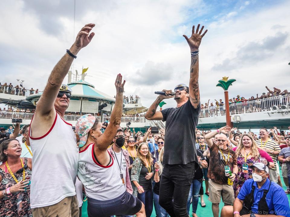 A packed pool deck wiuth performers on a Sixthman cruise.