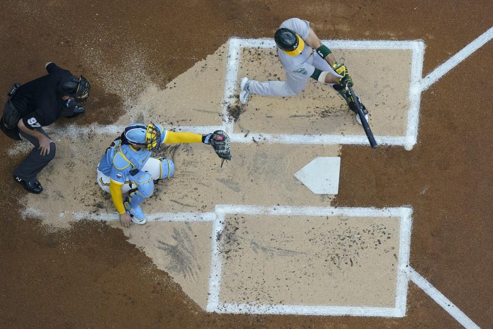 Oakland Athletics' Ramon Laureano hits a two-run scoring double during the first inning of a baseball game against the Milwaukee Brewers Friday, June 9, 2023, in Milwaukee. (AP Photo/Morry Gash)
