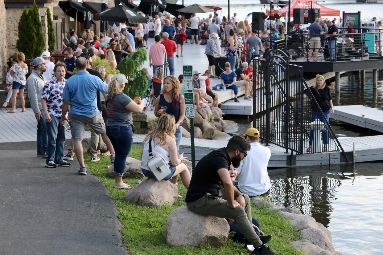 People are seen during Dinner on the Dock at Prairie Street Brewing Company Thursday, May 19, 2022, in Rockford. The annual event returns Thursday, May 11, 2023.
