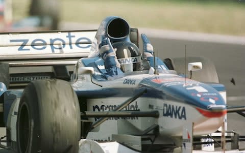 Damon Hill of Great Britain celebrates as his crosses the finish in his Arrows Yamaha for 2nd place in the Hungarian Grand Prix in Budapest - Credit: Mark Thompson/Getty Images