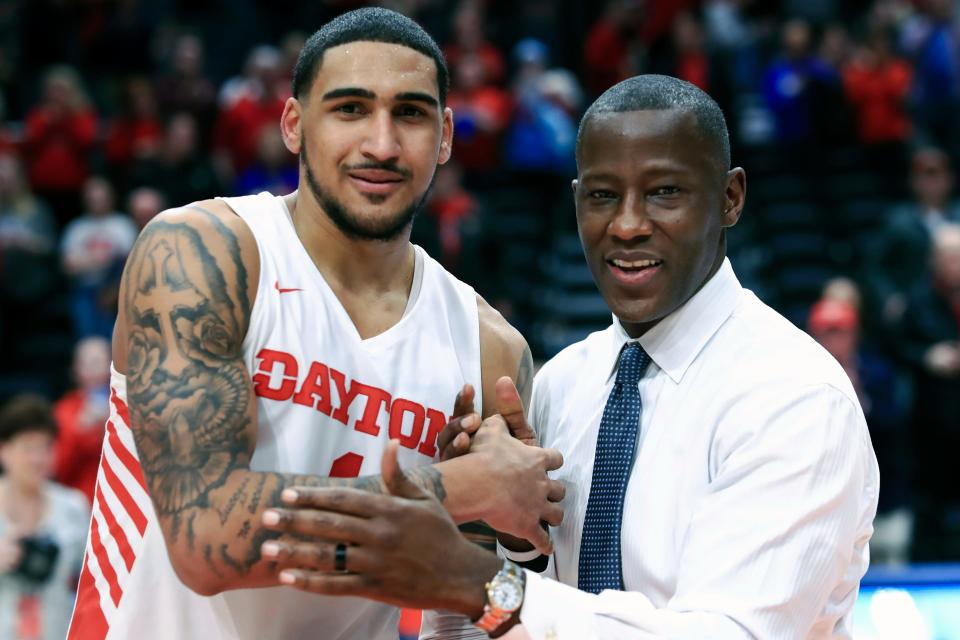 Obi Toppin celebrates scoring his 1,000th career point with coach Anthony Grant in March 2020. Dayton was expected to earn a high seed in the NCAA Tournament before it was canceled because of the pandemic.