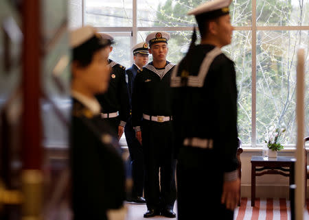 Chinese People's Liberation Army (PLA) Navy soldiers stand guard at a news conference ahead of the 70th anniversary of the founding of the Chinese People's Liberation Army Navy, in Qingdao, China, April 20, 2019. REUTERS/Jason Lee