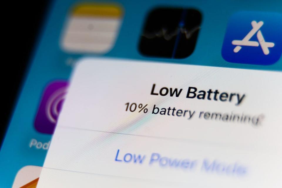 An iPhone with a pop-up message that says 10% battery remains.