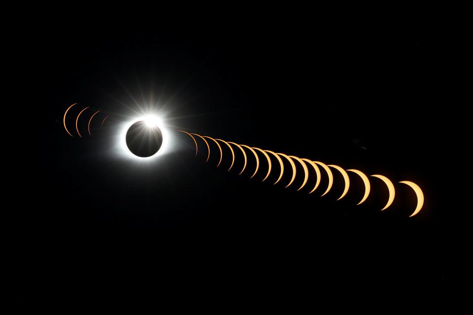 REFILE - CORRECTING HOW PHOTO WAS TAKEN A composite image of 21 separate photographs taken with a single fixed camera shows the solar eclipse as it creates the effect of a diamond ring at totality as seen from Clingmans Dome, which at 6,643 feet (2,025m) is the highest point in the Great Smoky Mountains National Park, Tennessee, U.S. August 21, 2017. Location coordinates for this image are 35º33'24" N, 83º29'46" W. REUTERS/Jonathan Ernst  TPX IMAGES OF THE DAY