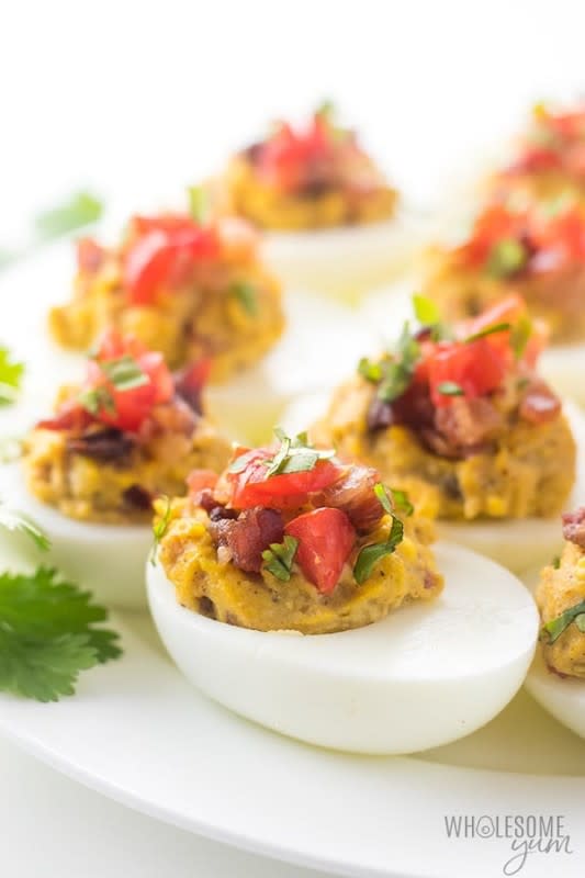 <p>Wholesome Yum</p><p>These keto-deviled eggs with avocado and bacon are easy to make.</p><p><strong>Get the recipe: </strong><a href="https://www.wholesomeyum.com/mexican-keto-deviled-eggs-recipe-with-avocado-and-bacon/" rel="nofollow noopener" target="_blank" data-ylk="slk:Mexican Keto Deviled Eggs;elm:context_link;itc:0;sec:content-canvas" class="link "><strong>Mexican Keto Deviled Eggs</strong></a></p>