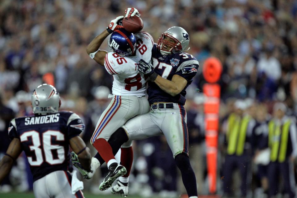 New York Giants David Tyree #85 catches a pass against the New England Patriots Rodney Harrison #37 during the Super Bowl XLII football game at University of Phoenix Stadium on Sunday, Feb. 3, 2008 in Glendale, Ariz.