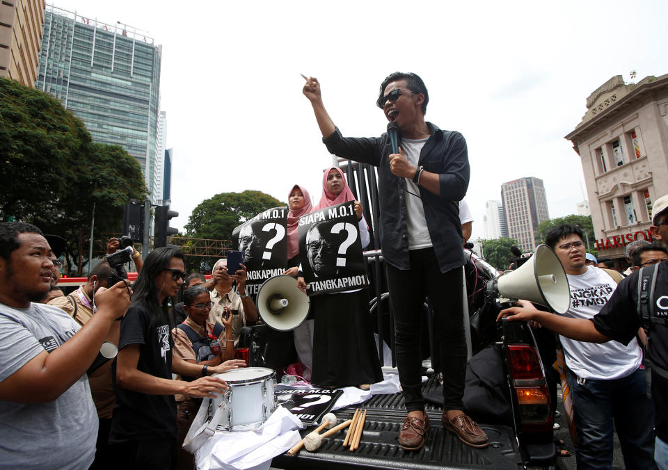 Student activists shout slogans as they prepare to march towards Dataran Merdeka