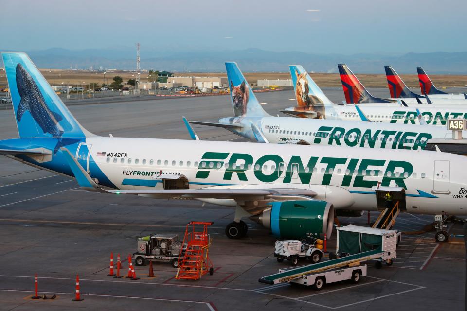 Frontier Airlines jets sit at gates at Denver International Airport on Sept. 22, 2019, in Denver.