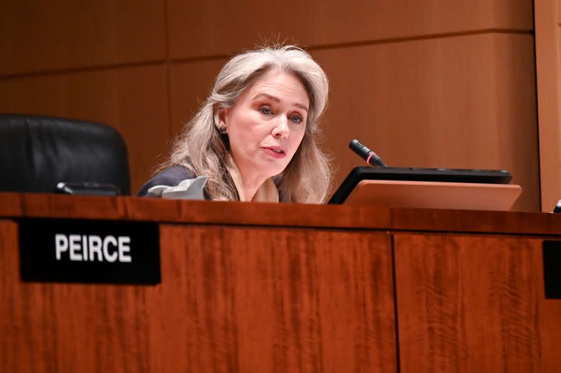 FILE PHOTO: Commissioner Lee participates in a U.S Securities and Exchange Commission open meeting in Washington