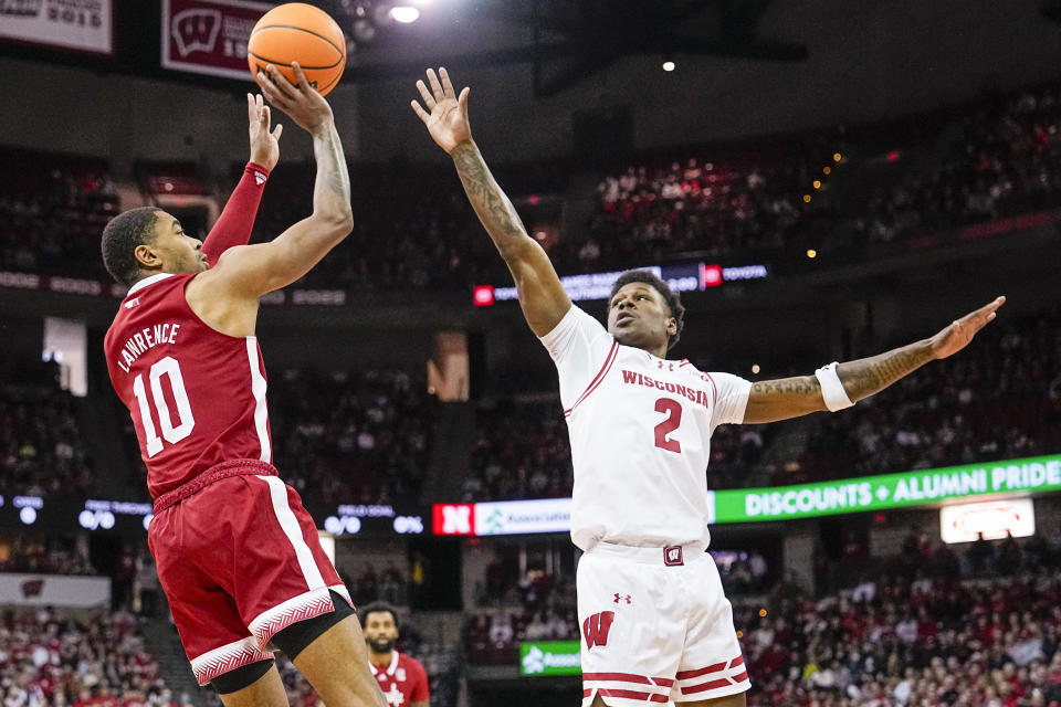 Nebraska's Jamarques Lawrence (10) shoots against Wisconsin's AJ Storr (2) during the first half of an NCAA college basketball game Saturday, Jan. 6, 2024, in Madison, Wis. (AP Photo/Andy Manis)