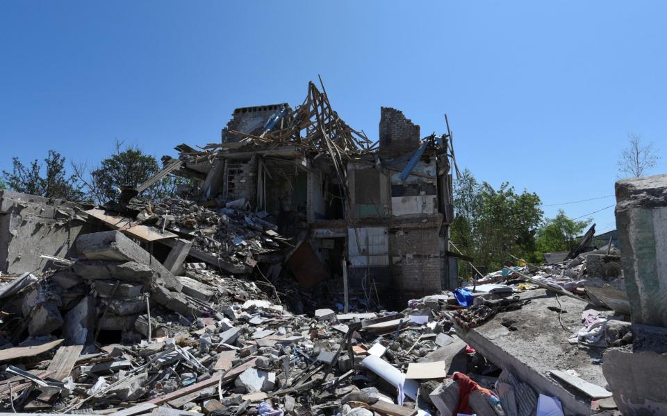 A two-storey apartment building left in ruins - Reuters