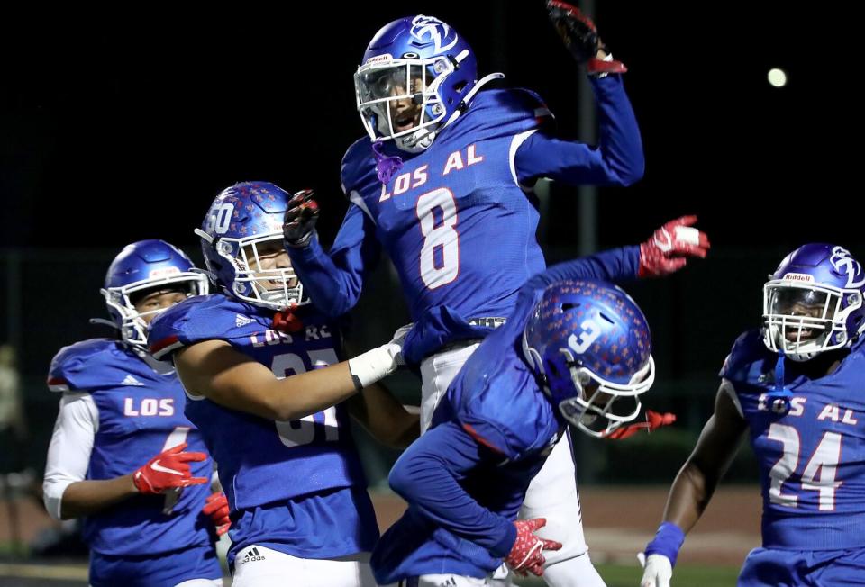Los Alamitos wide receiver Ethan O'Connor celebrates after scoring a touchdown against Edison.