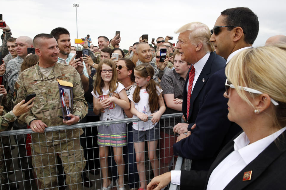 President Donald Trump greets guests after arriving on Air Force One at Offutt Air Force Base in Bellevue, Neb., Tuesday, June 11, 2019, to tour a renewable energy facility in Council Bluffs, Iowa. (AP Photo/Patrick Semansky