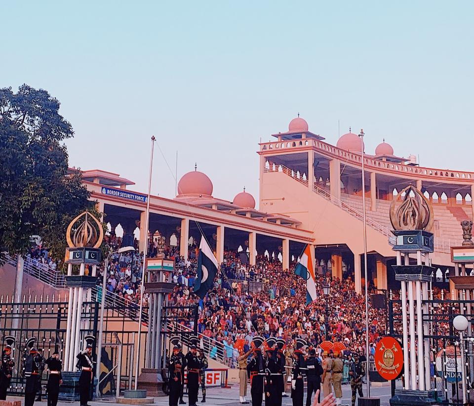 One episode of Neha Aziz's podcast "Partition" includes reflections on a trip to witness the Wagah Border Ceremony in 2019. Each evening at sunset, spectators gather to watch Indian and Pakistani troops face off and one up each other with demonstrations of military pomp.