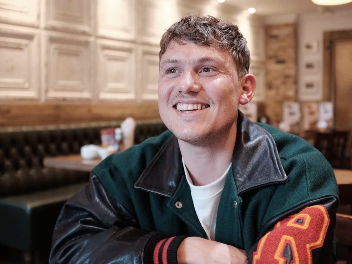 Jon Pointing in his local cafe in Lewisham (The Independent)